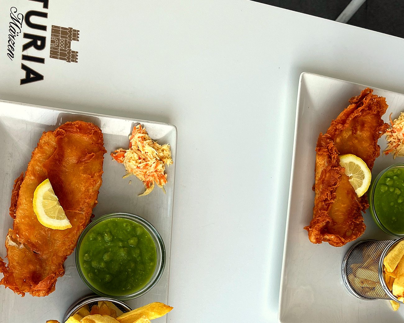 Two plates of fish & chips, eat in on the terrace